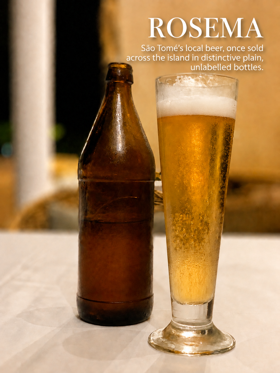 brown glass beer bottle with no label and glass of beer